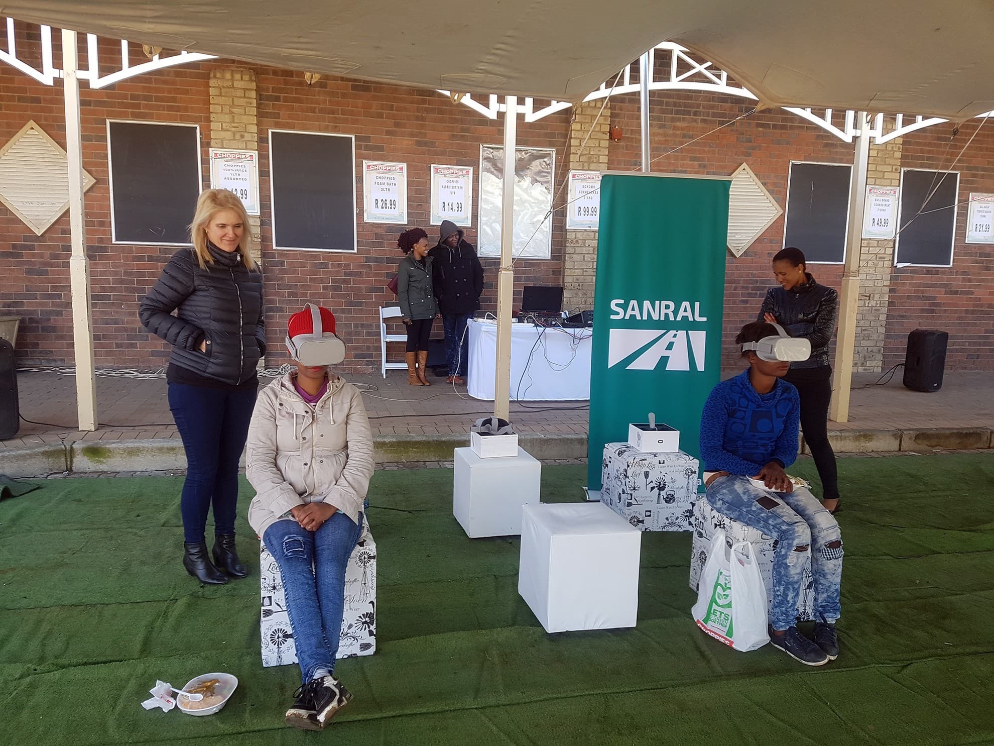 Community members gathering at the SANRAL VR activation gazebo