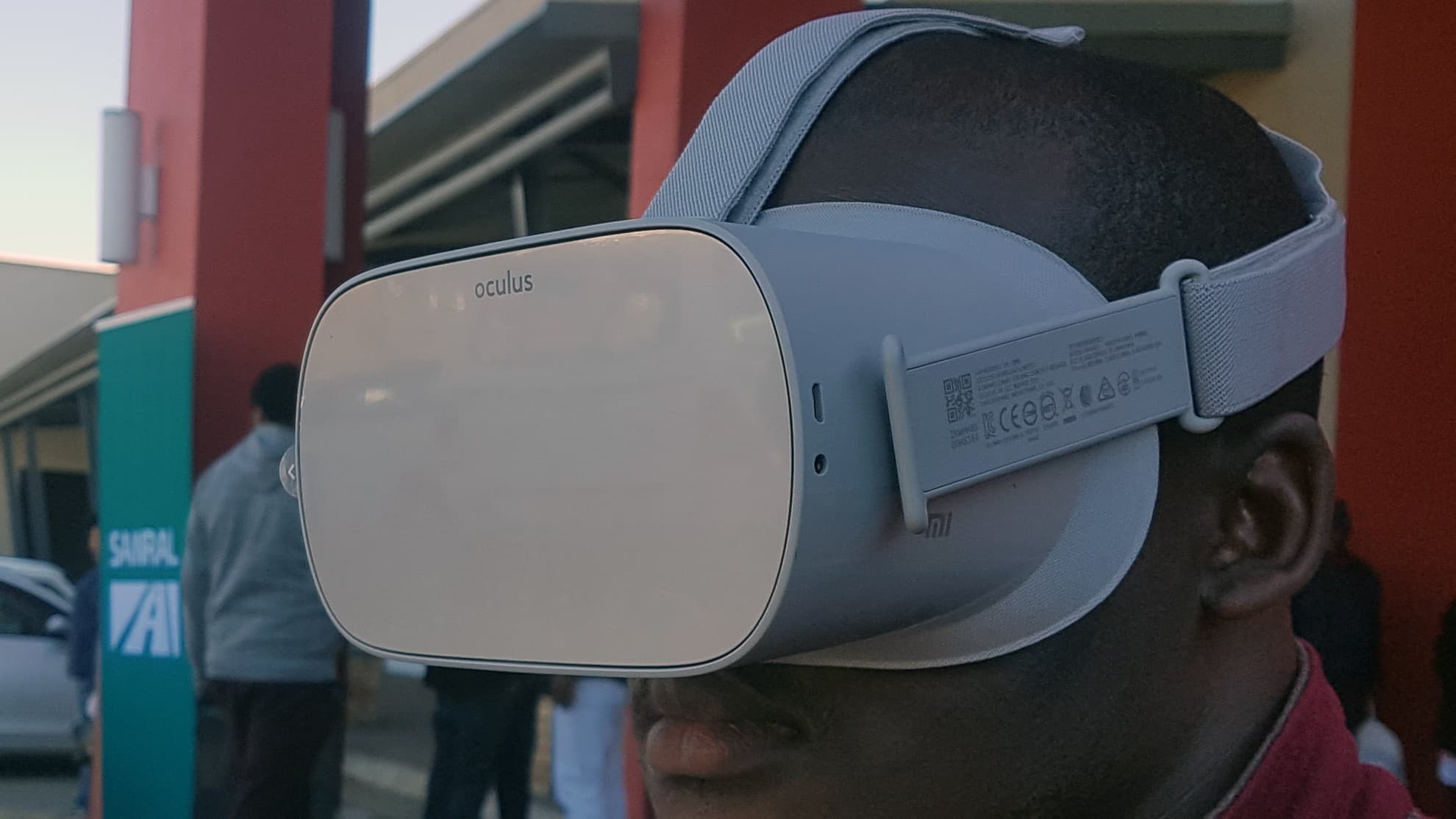 Facilitator assisting a driver with an Oculus Go headset
