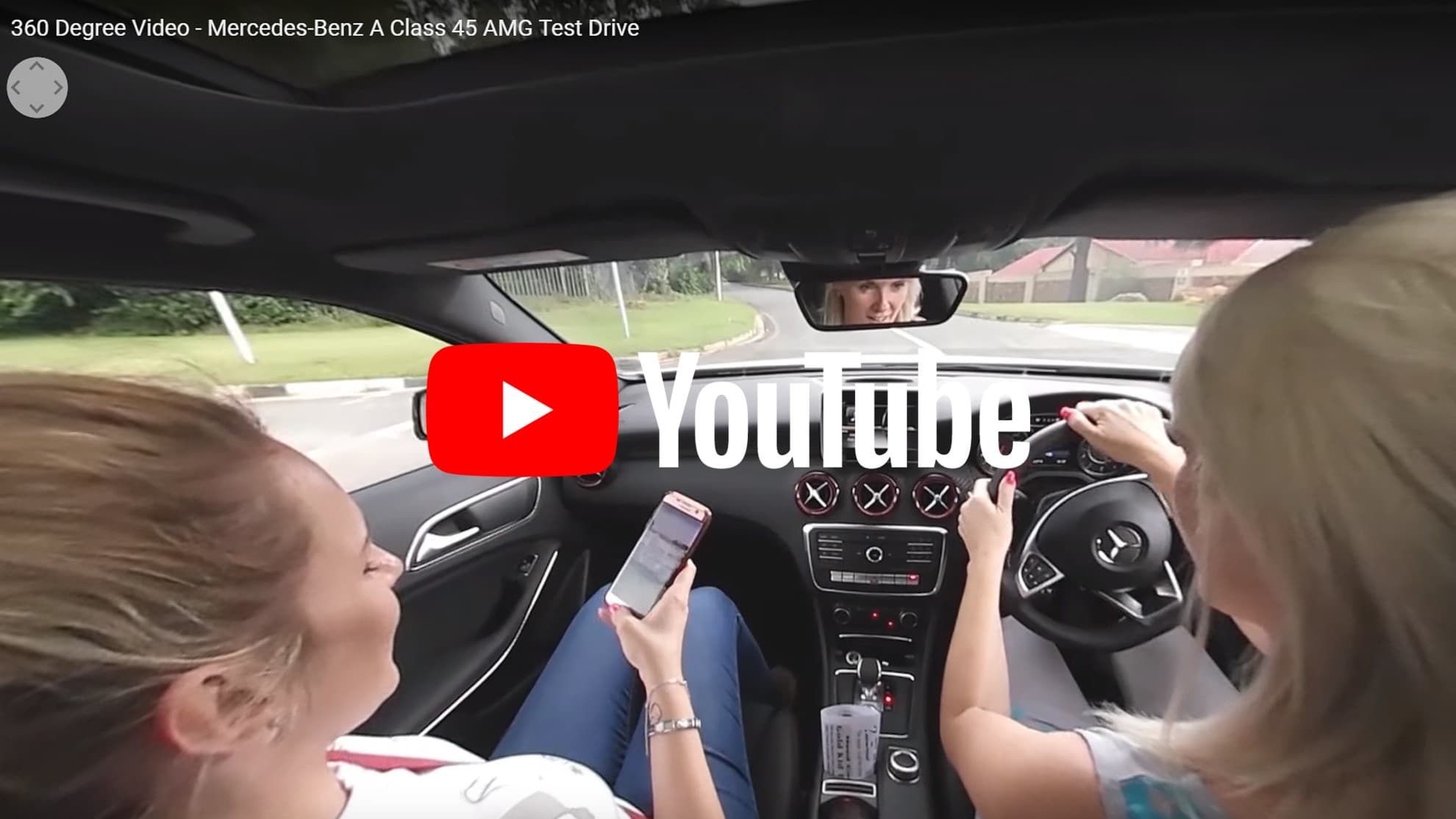 Driver and passenger inside Mercedes-Benz A 45 AMG during 360-degree test drive