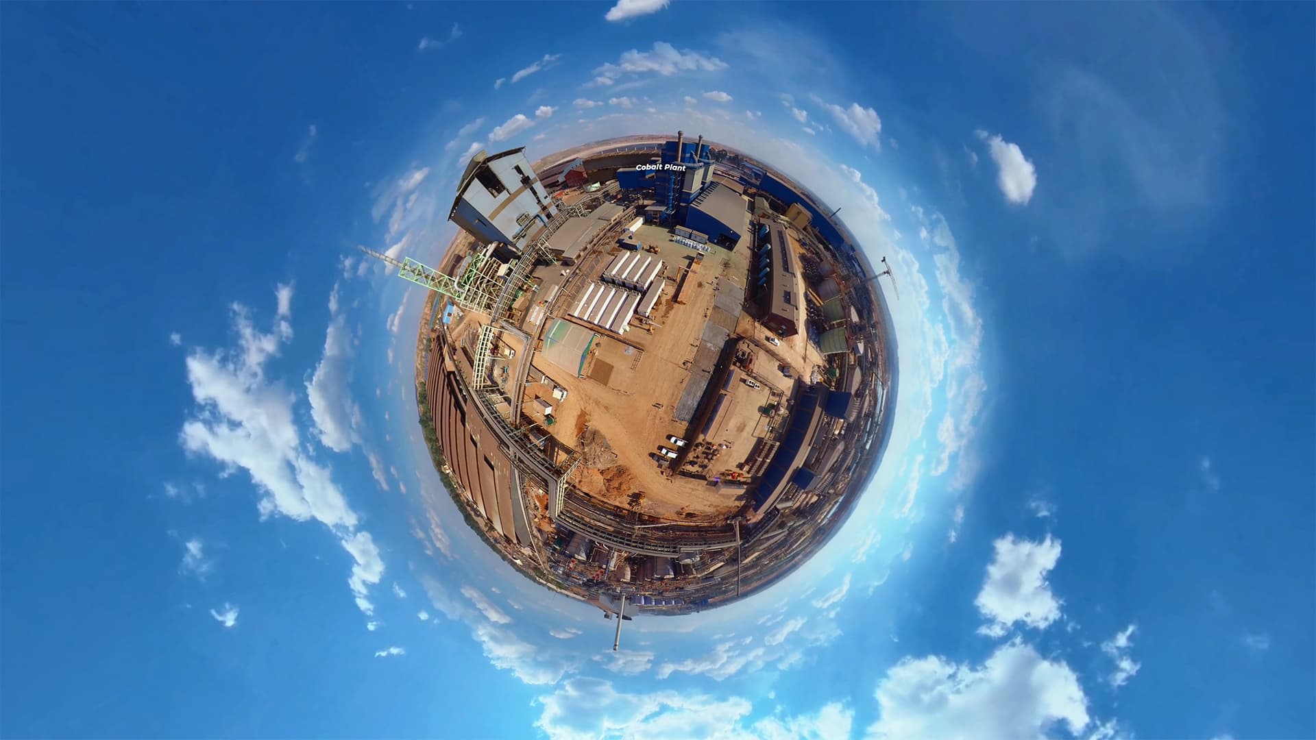 A tiny-planet projection of a panoramic location with blue sky surrounding it