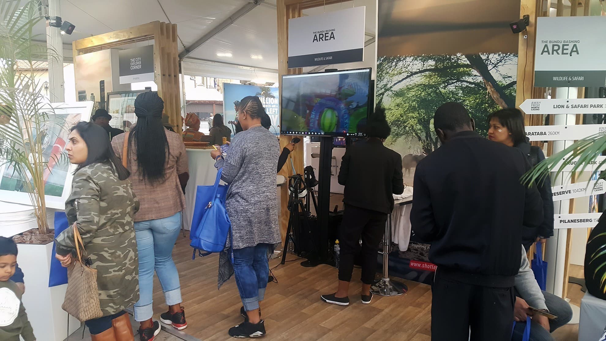 Exhibition visitors exploring South African travel destinations