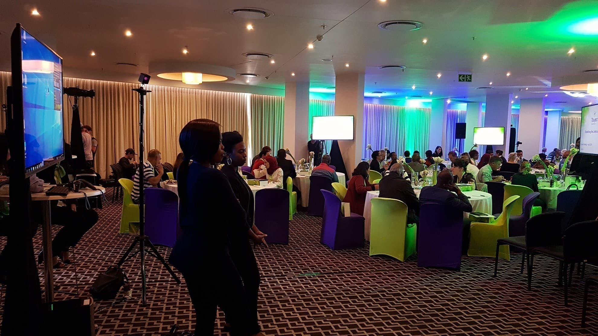 Corporate VR event activation space with branded displays and guests