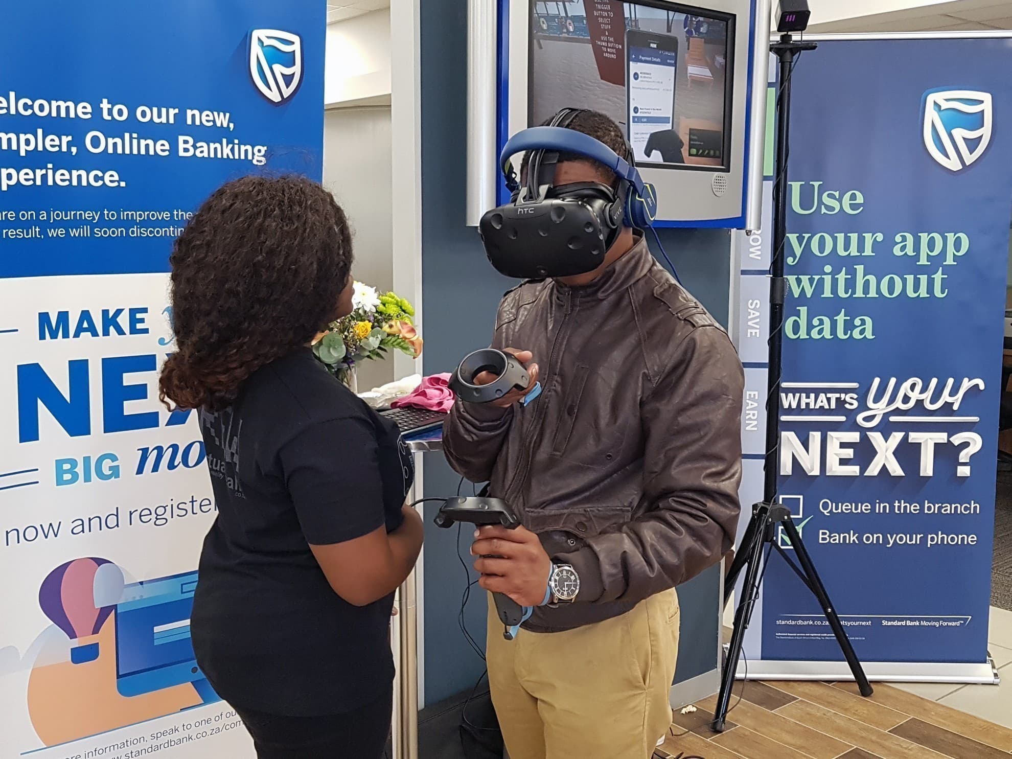 A participant wearing a VR headset at a Standard Bank activation