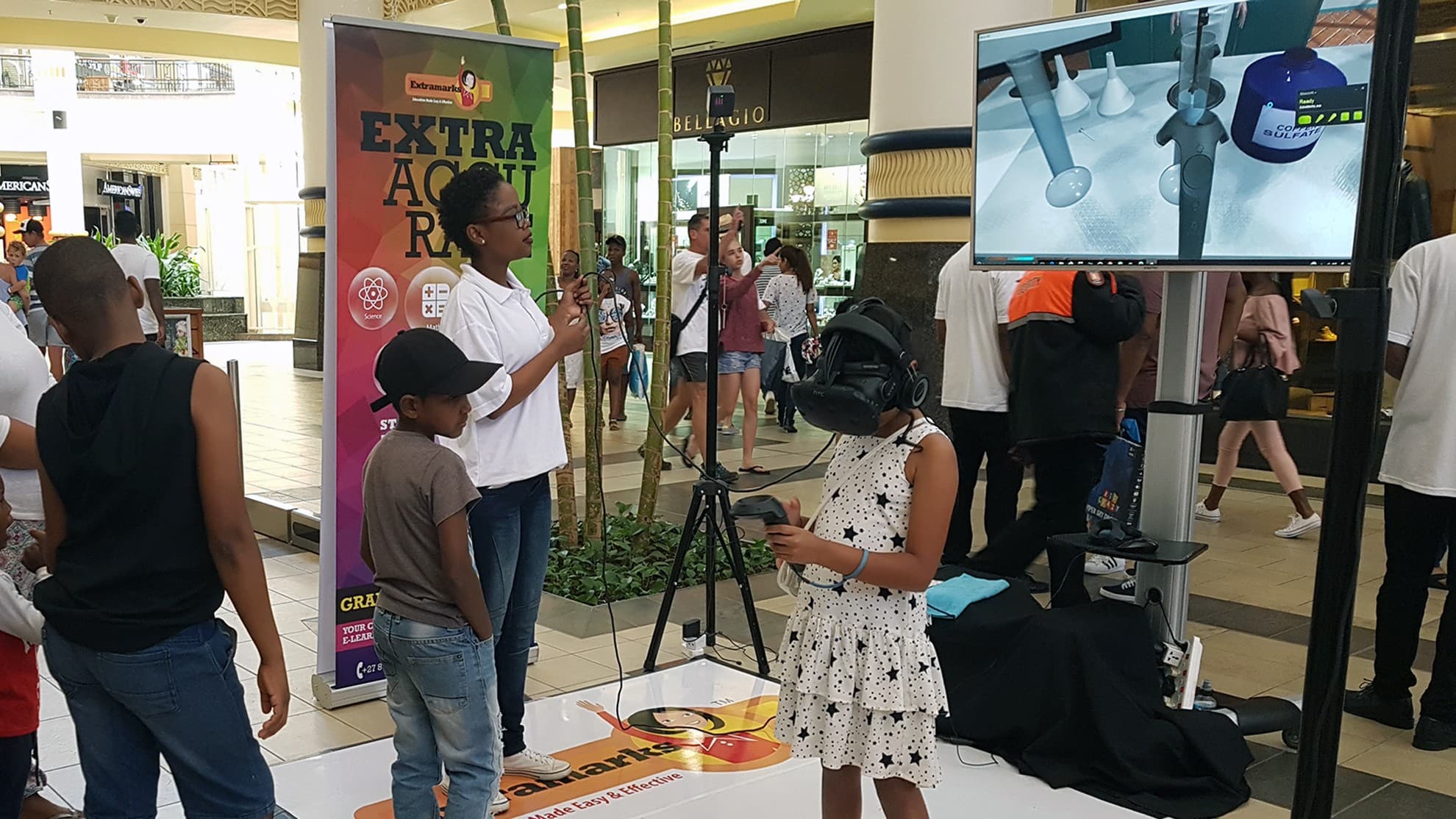 Children taking part in a virtual reality science activity with an instructor