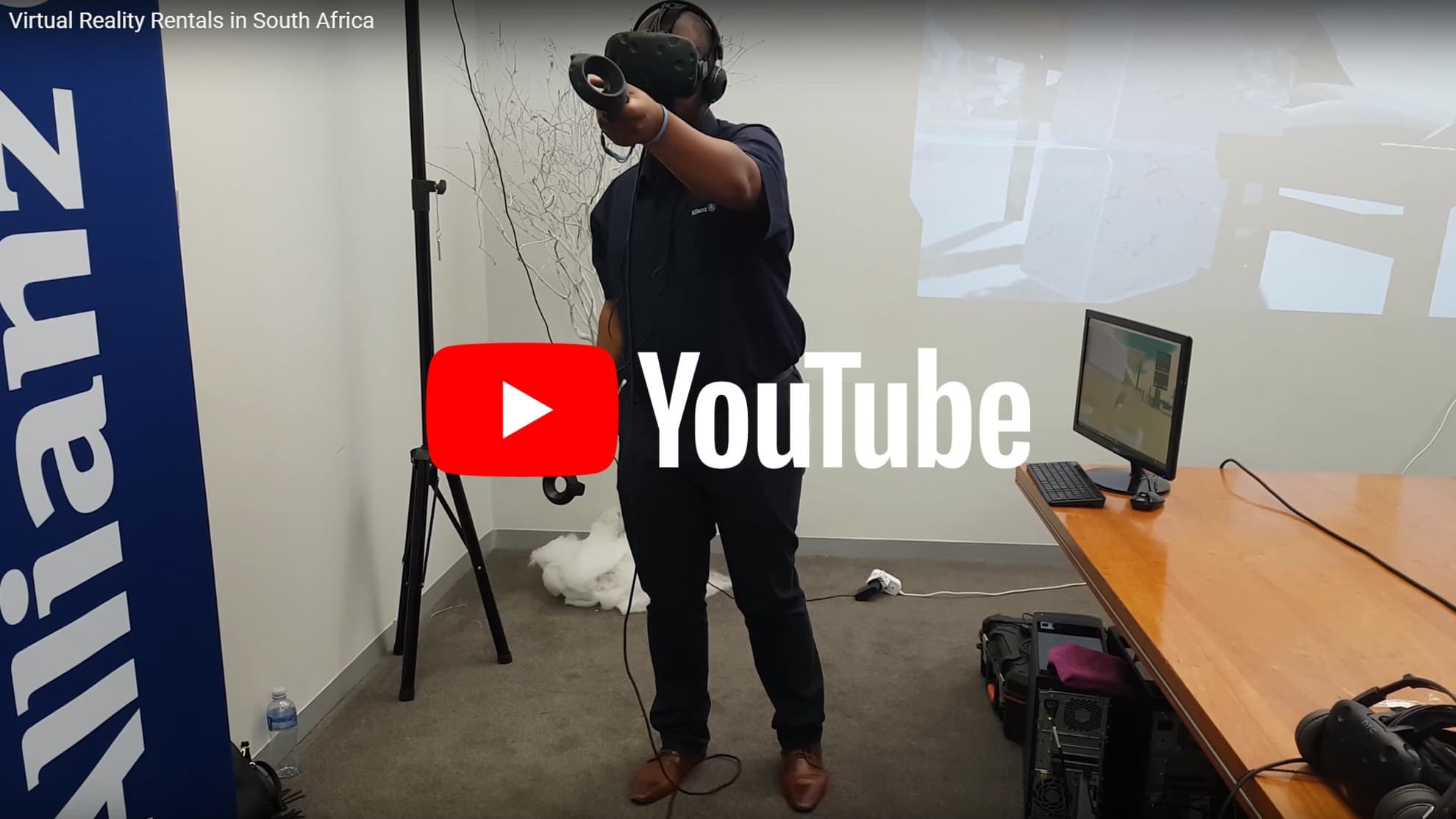 A participant using a virtual reality headset and controllers at an event