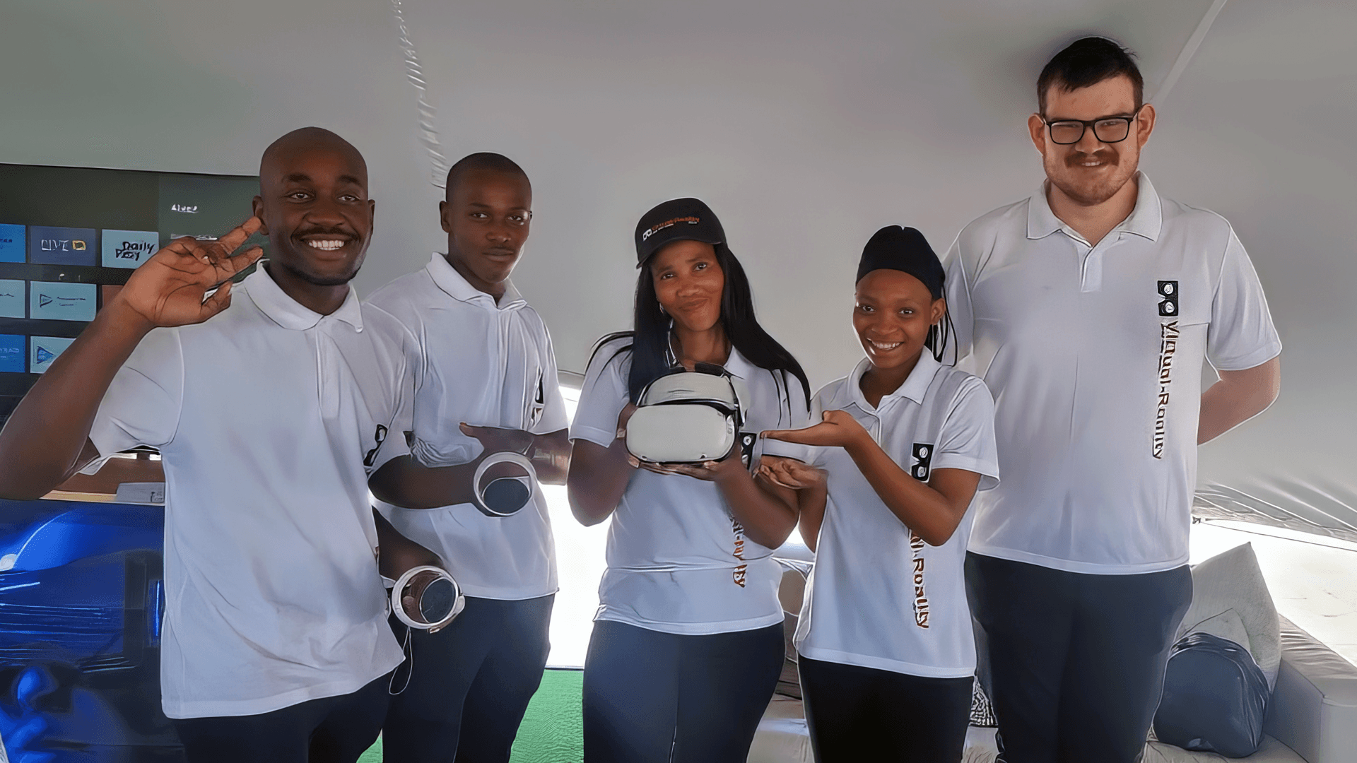 Virtual Reality South Africa team members holding VR equipment at an event