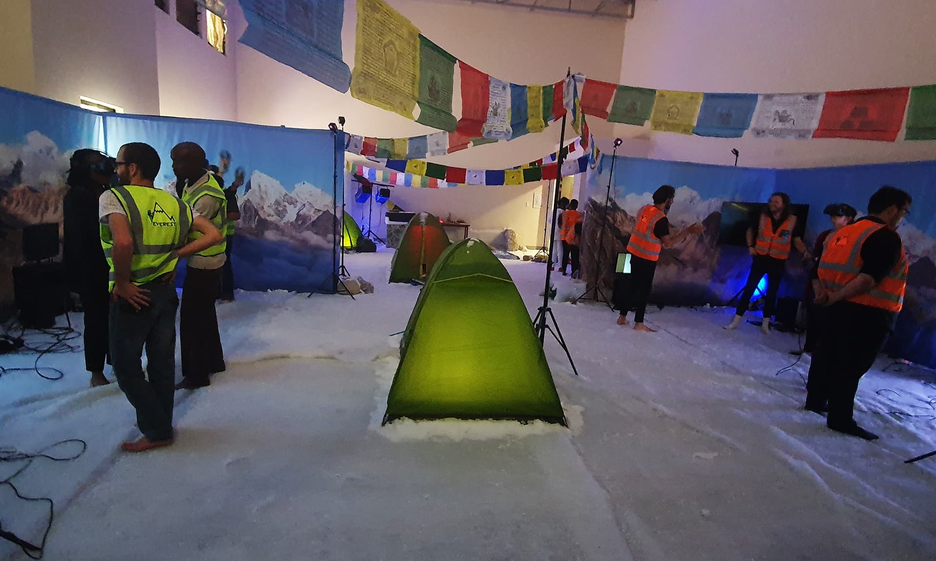 Atmospheric lighting and custom mountain backdrop across the activation venue
