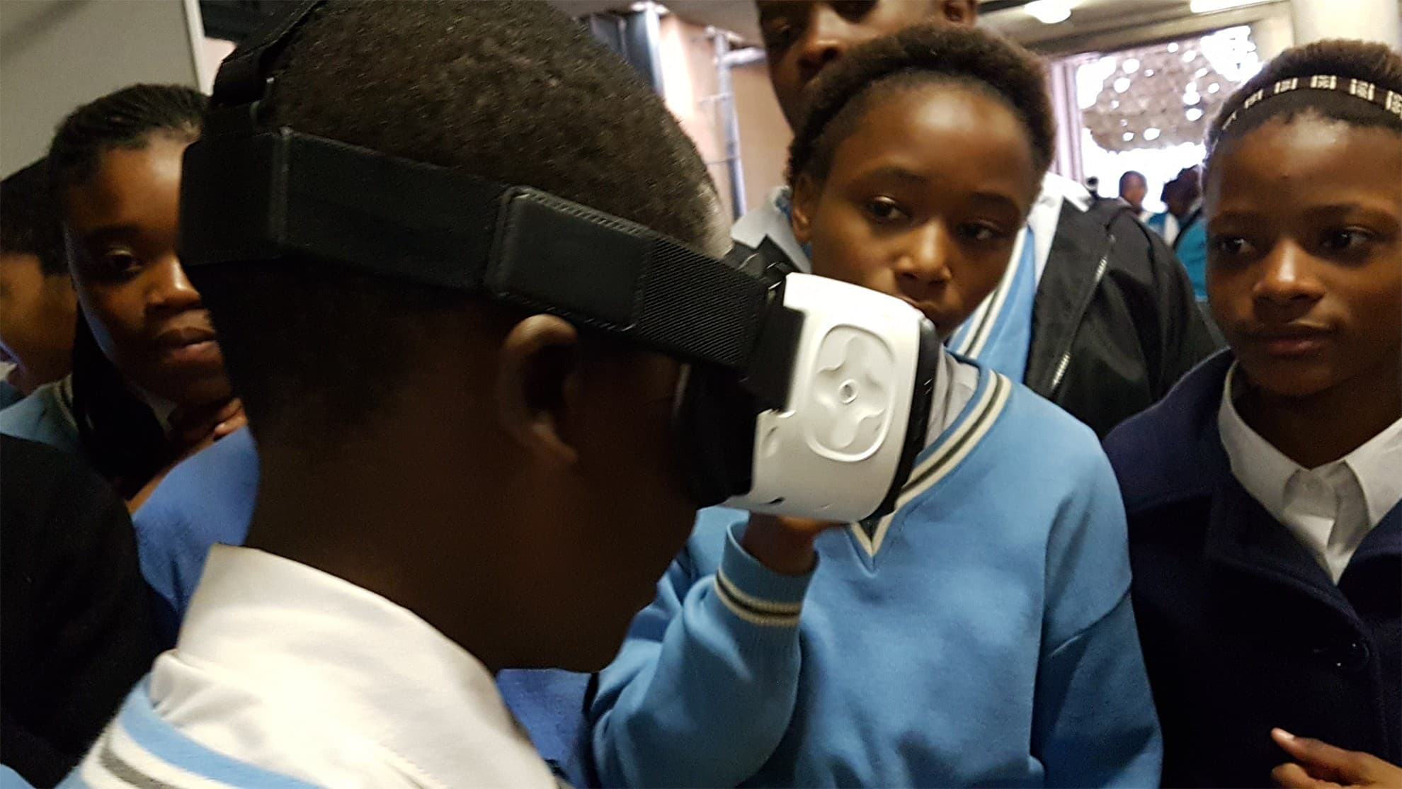 A participant using a Samsung Gear VR headset at an education event