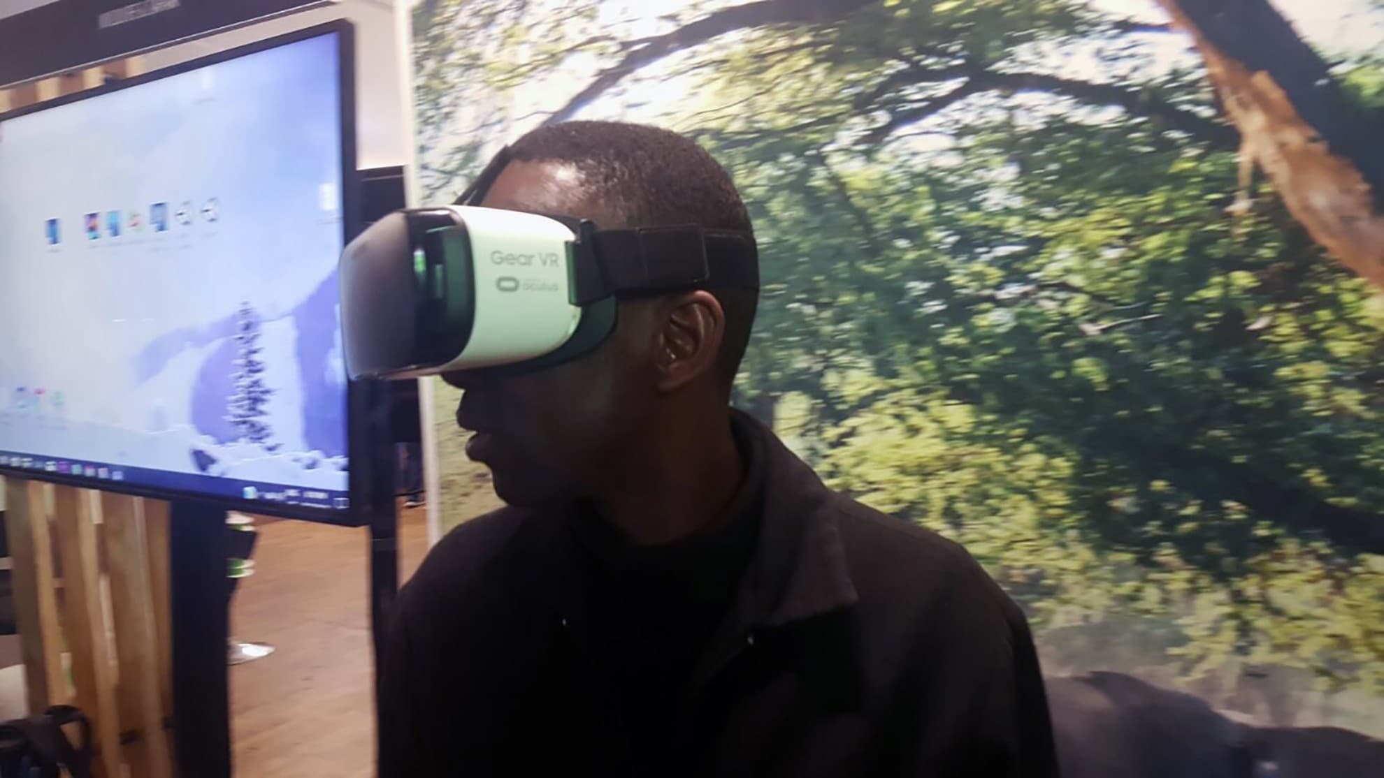 Guest viewing a Gear VR experience against a tourism backdrop