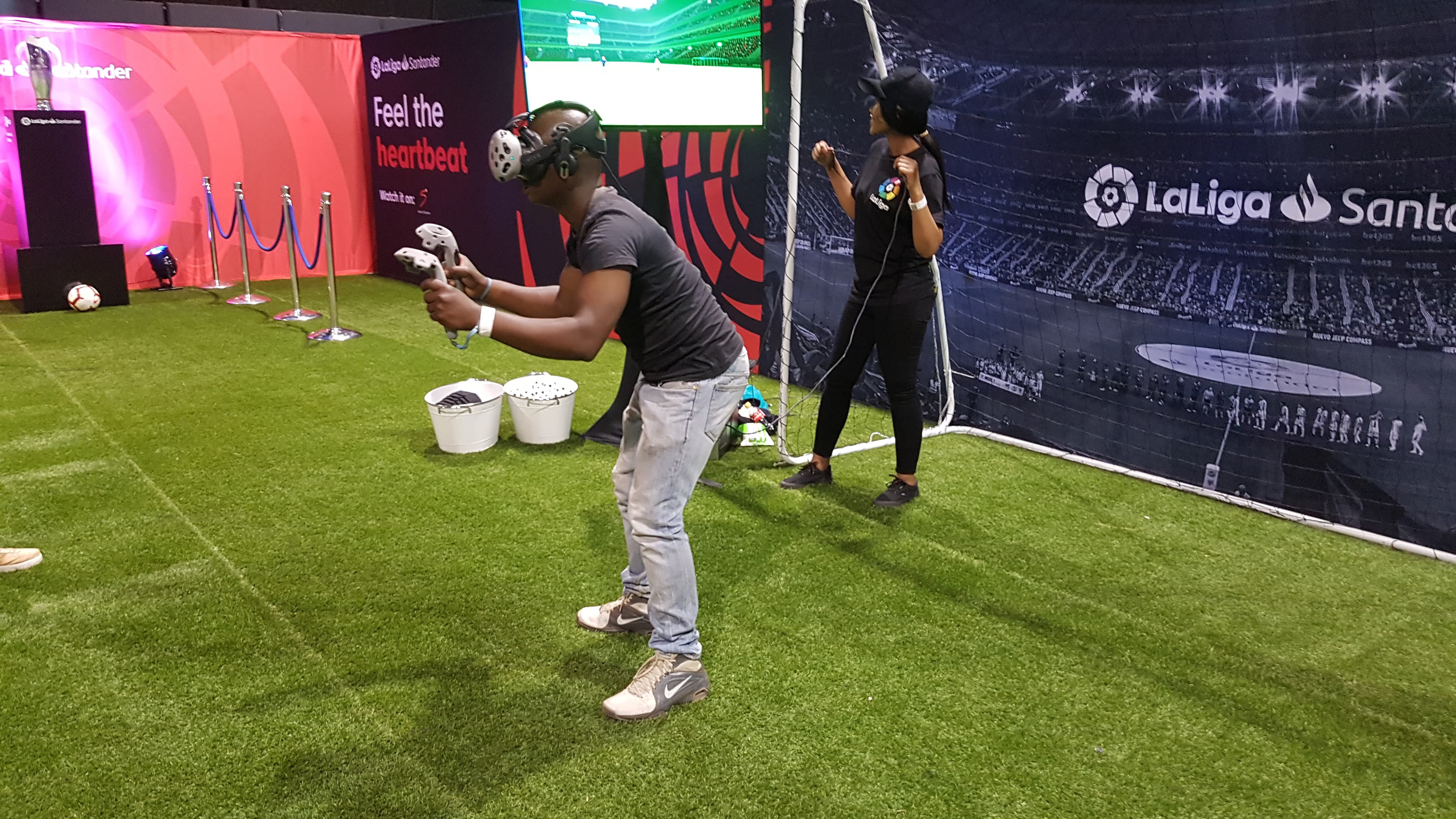 Soccer fan diving for virtual ball in VR headset