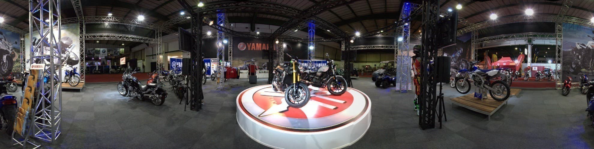 A panoramic view of motorcycles and exhibition stands at the AMID show
