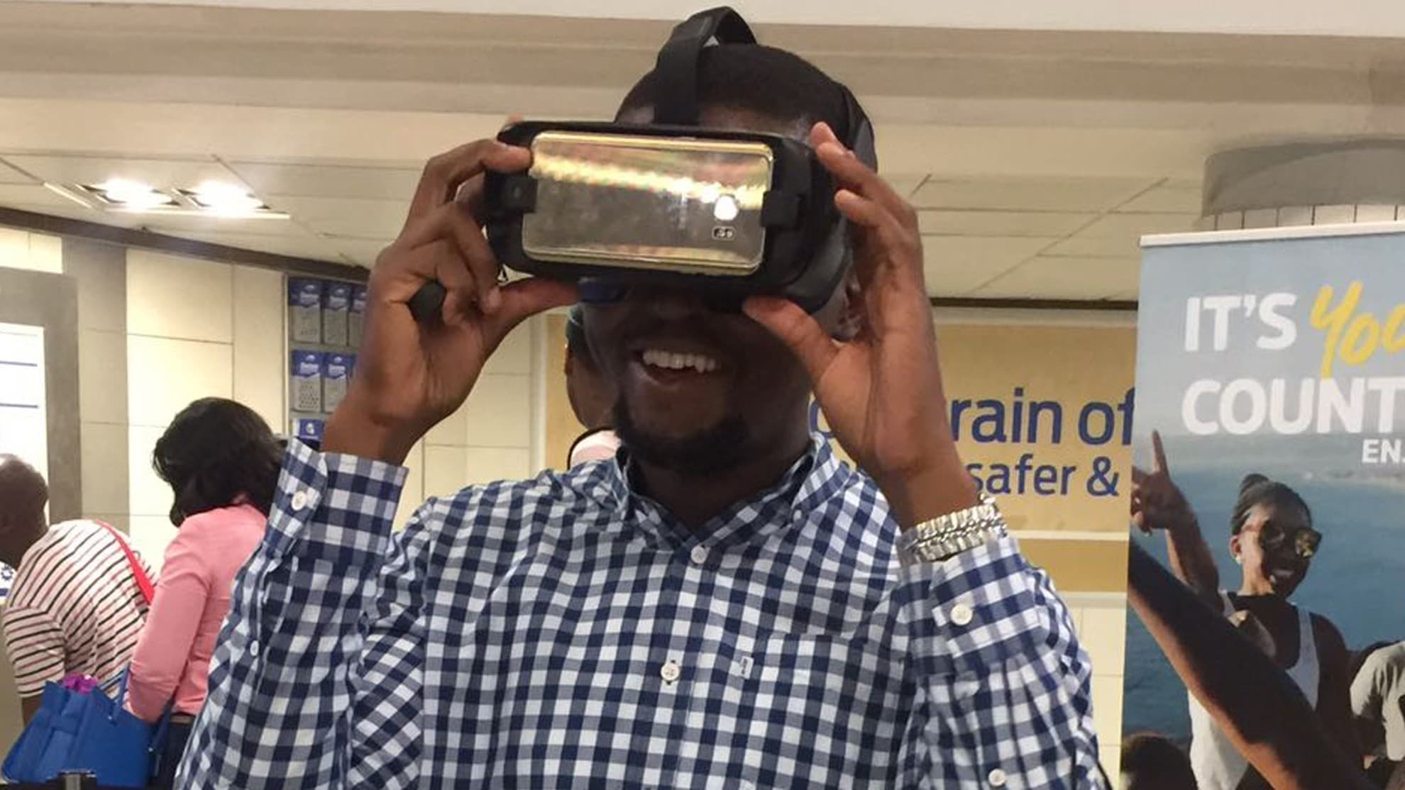 Participant holding a smartphone-powered VR headset