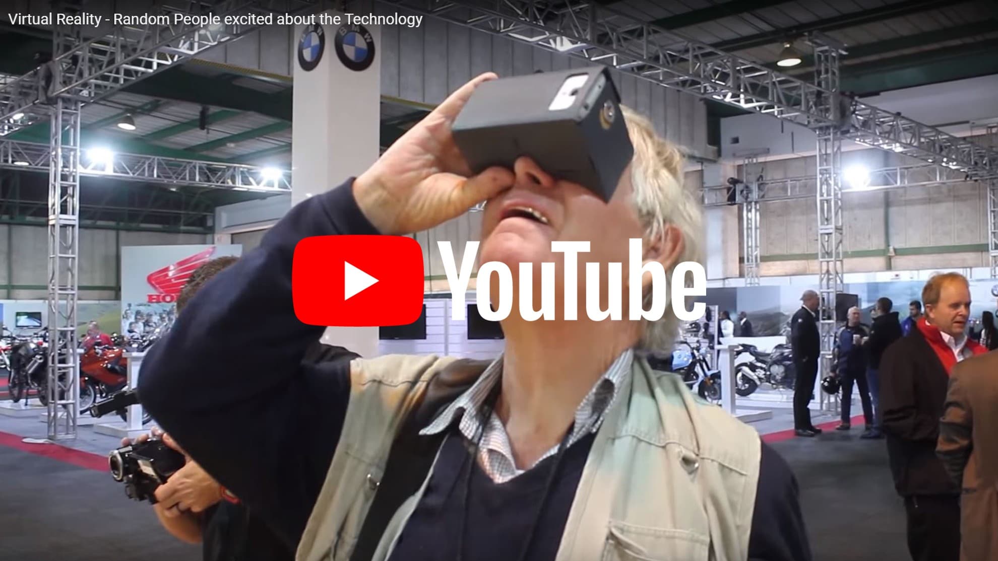 A visitor trying a VR headset at the AMID Motorcycle Show
